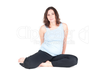 Portrait of pretty pregnant woman practicing yoga