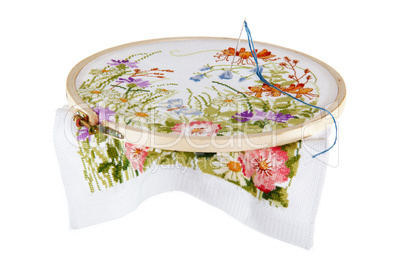 Embroidery of a picture with the image of colours, on a white ba