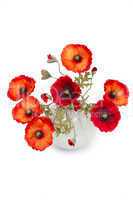The image of a bouquet of artificial poppies in a vase, isolated
