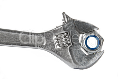 The image of a wrench with a nut, isolated, on a white backgroun