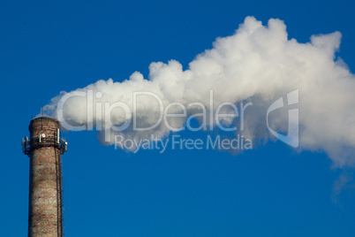 The image of a factory pipe from a smoke leaving it against the