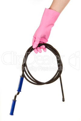 Female hand in a pink glove keeps a hawser for the water drain,