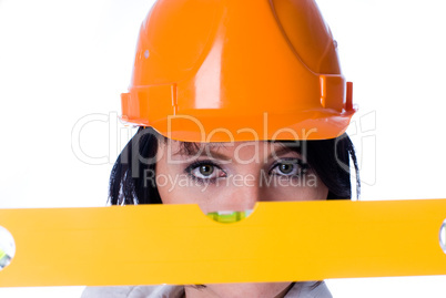 Woman in helmet with level