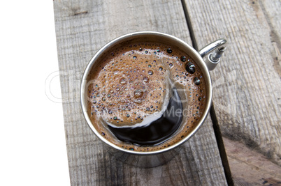 Metal mug of coffee