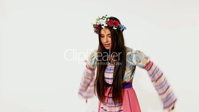 Beauty russian girl with garland - ethnic dance