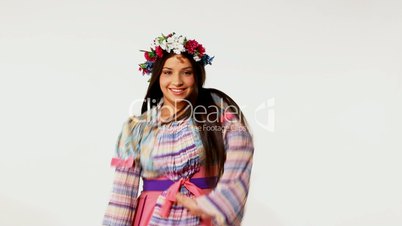 Young russian girl with garland - ethnic dance