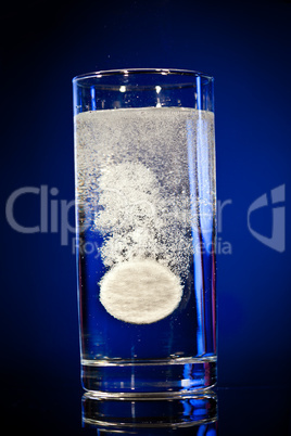 Tablet in a water glass