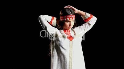 Young girl dance in traditional russian costume