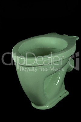 The light green toilet bowl, isolated on black background