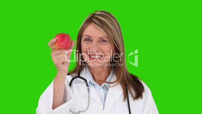 Ärztin mit Apfel
