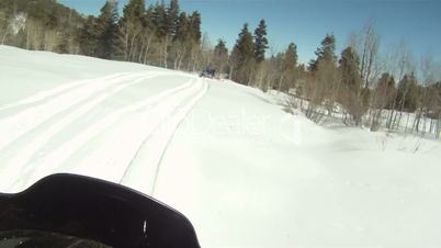 Snowmobile following rider on mountain P HD 04