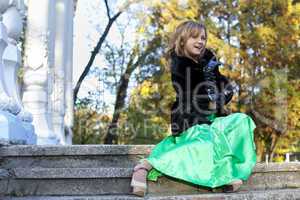 Beauty woman in green clothes and fur coat