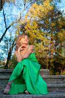 Beauty woman in green clothes posing and smile