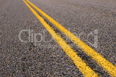 yellow dividing lines on the highway.