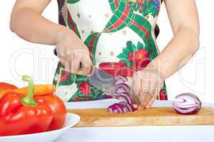 Woman cutting onion isolated on white