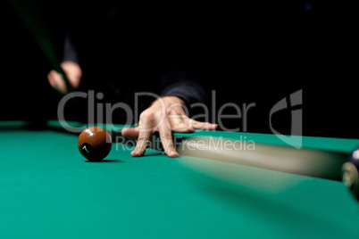 Ball rolling on green table in billiard