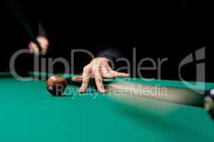 Ball rolling on green table in billiard