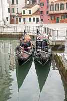 Two gondola in Venice at the pier
