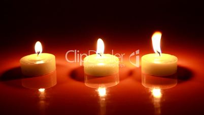 Three Candles in blackness