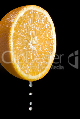 orange citrus fruit with juice drops