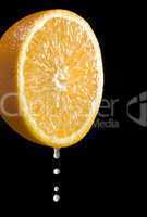orange citrus fruit with juice drops