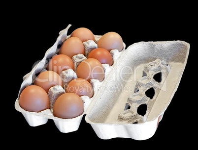 Box with hen eggs isolated on black