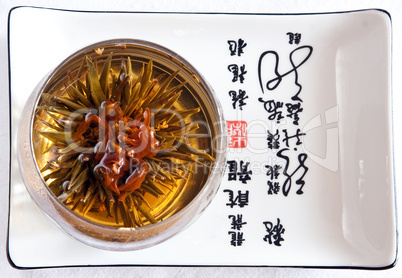 Japanese tea needles in the glass on plate
