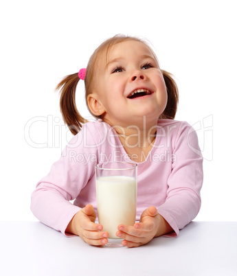 Little girl with a glass of milk