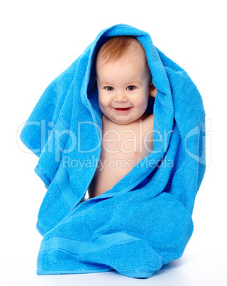 Cute child wrapped in blue towel