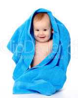 Cute child wrapped in blue towel