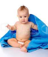 Cute child wrapped in blue towel