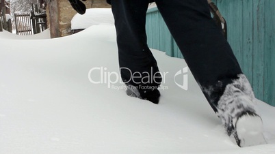 Man walking forward in deep snow - rural scene