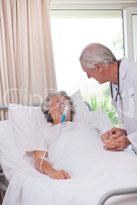Senior doctor with his sick patient