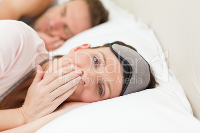 Lovely couple lying down in their bed