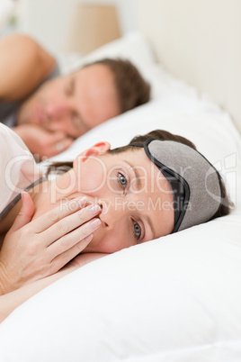 Lovely couple lying down in their bed