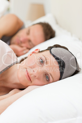 Lovely couple lying down in their bed