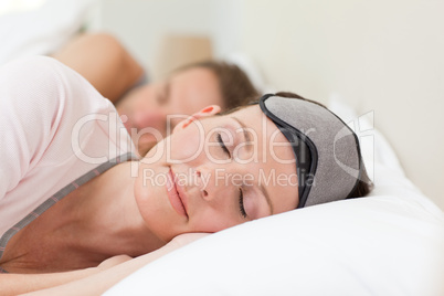 Lovely couple lying down in their bed