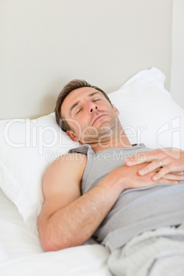 Man sleeping on his bed