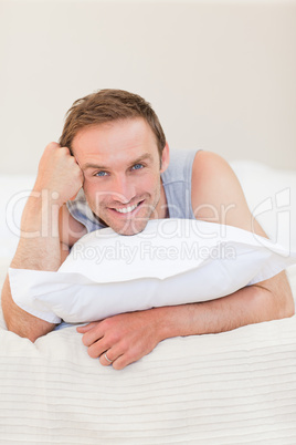 Man lying down on his bed