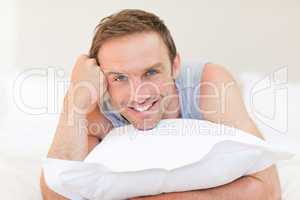 Man lying down on his bed