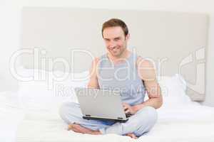 Man working on his laptop at home