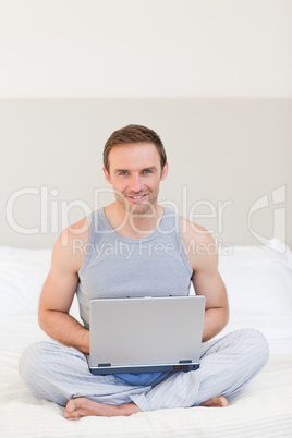 Man working on his laptop at home