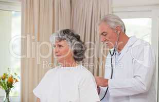 Doctor examining his  patient