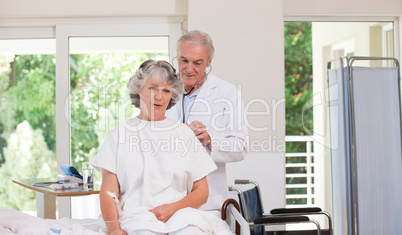 Doctor examining his  patient