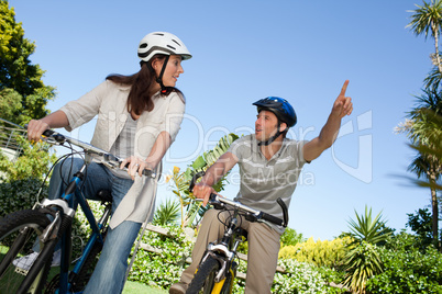 Joyful couple with their bikes