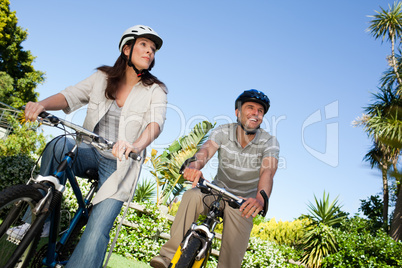 Joyful couple with their bikes