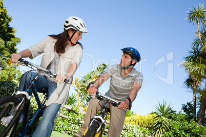 Joyful couple with their bikes
