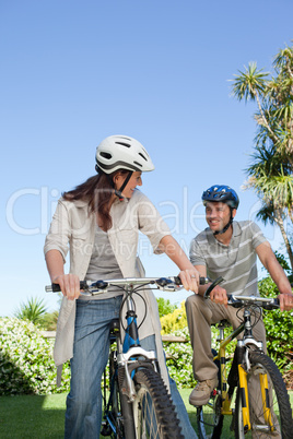 Joyful couple with their bikes