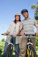 Joyful couple with their bikes