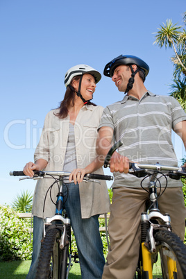 Joyful couple with their bikes